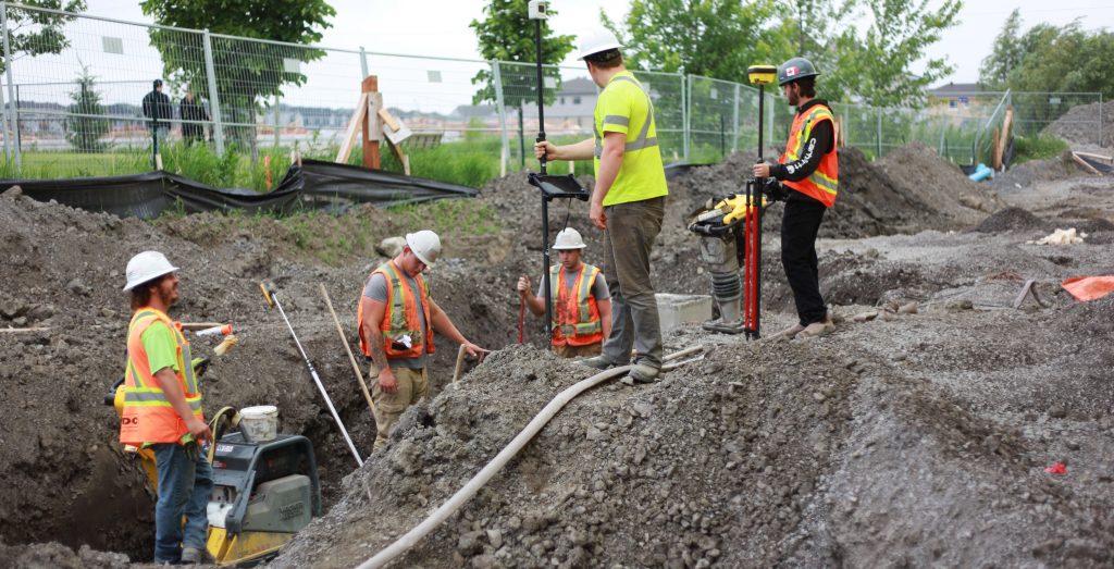 men working in the trench